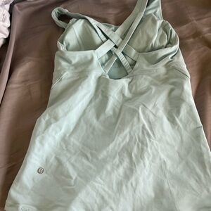 Lt green/teal bra tank. 1 small spot on side